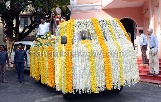 vehicle rally carrying the  statue of Pope John Paul II